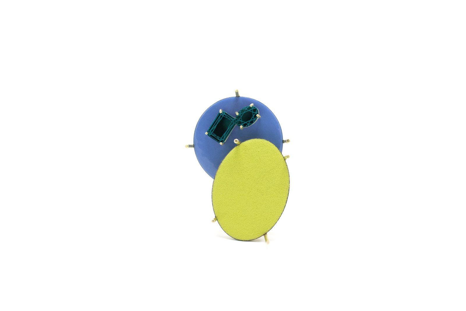 Blue circle with green stones overlapping a large yellow oval